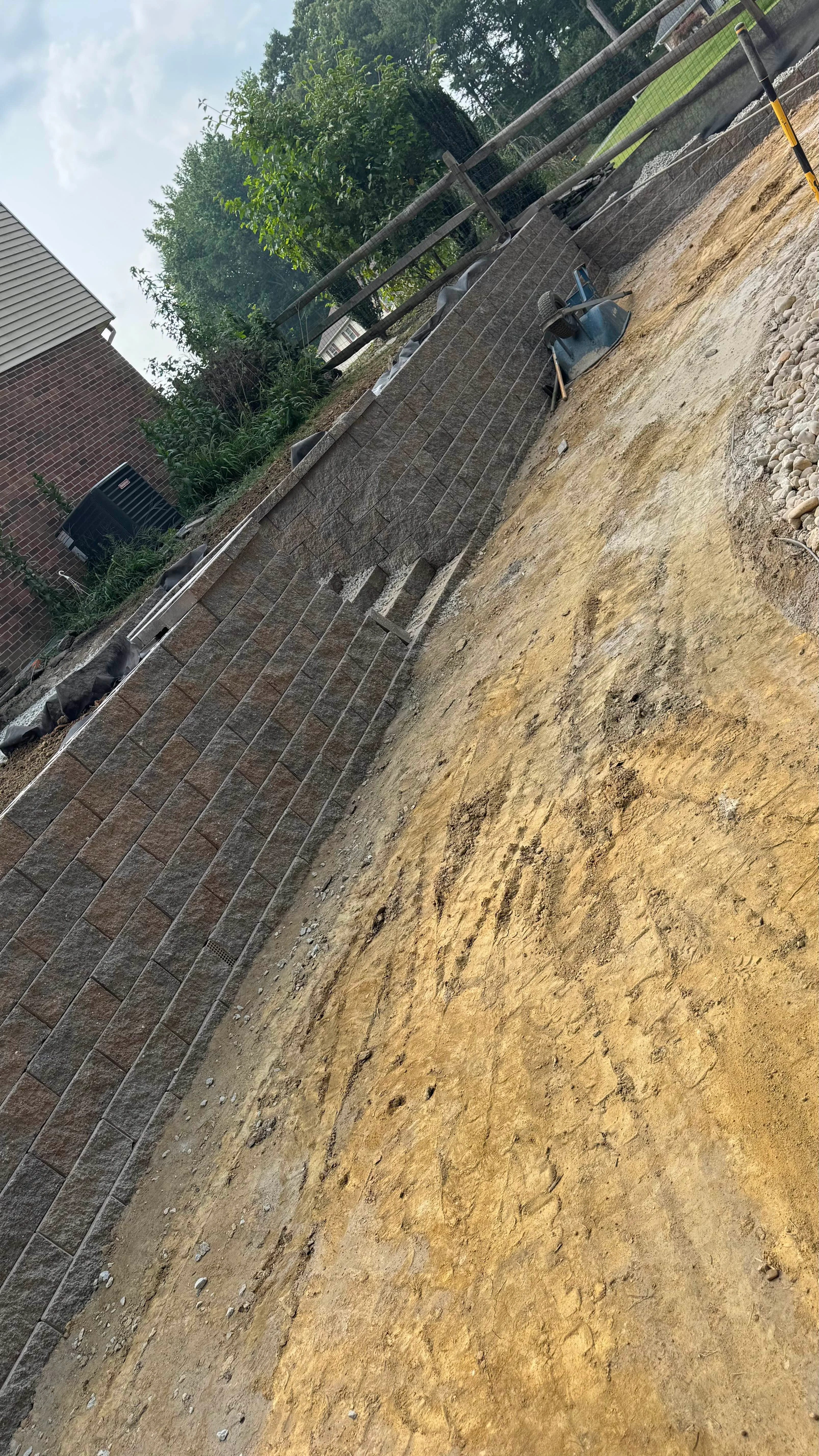 Retaining Walls featuring integrated steps with segmental wall block in Newark, Delaware