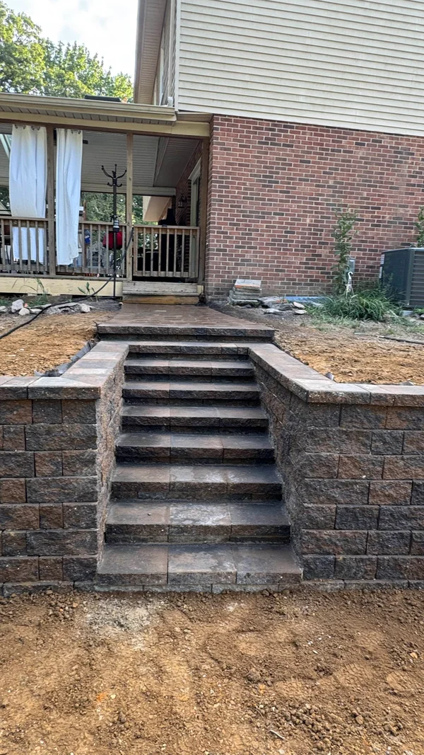 Retaining Walls featuring integrated steps with segmental wall block in Newark, Delaware