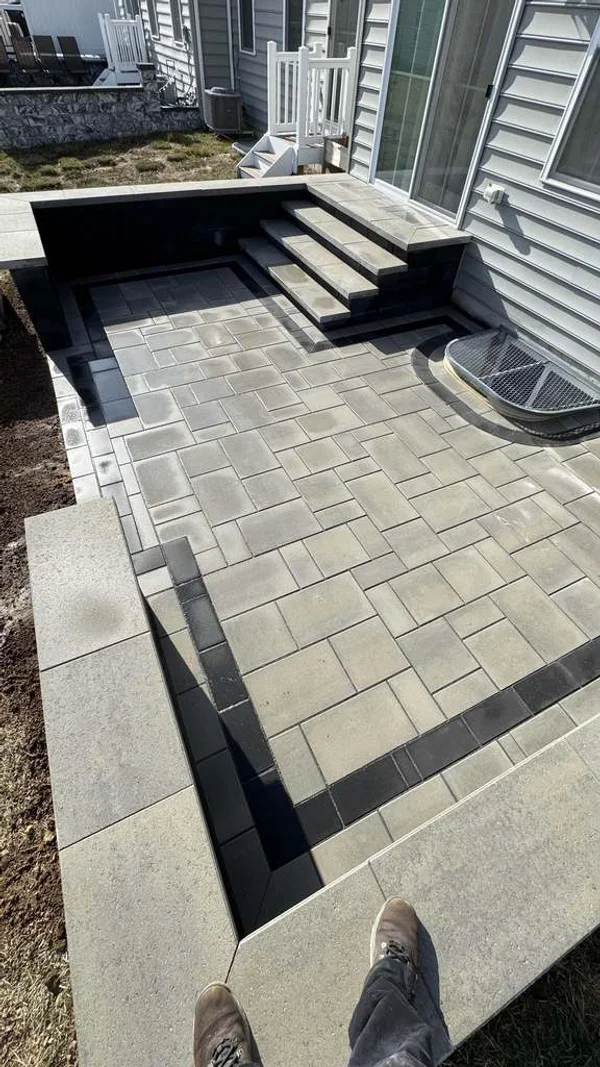 Concrete patio with curved charcoal border