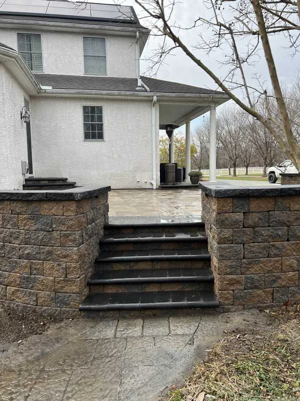 Patio with steps and seat wall
